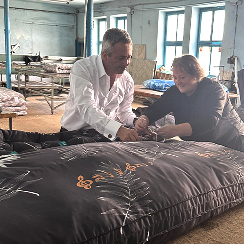 Man and woman assemble a mattress