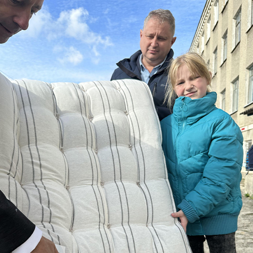 Woman receives a mattress